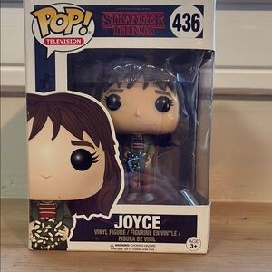 Funko Pop Figure with Brown Hair and Blue Shirt